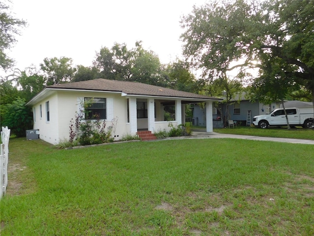 507 Francis Blvd, Lakeland, FL 33801 - ranch-style house with a front lawn and stucco siding