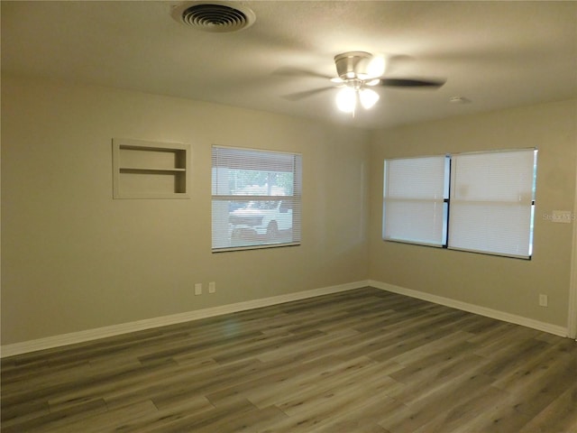 507 Francis Blvd, Lakeland, FL 33801 - empty room with dark wood finished floors and a ceiling fan