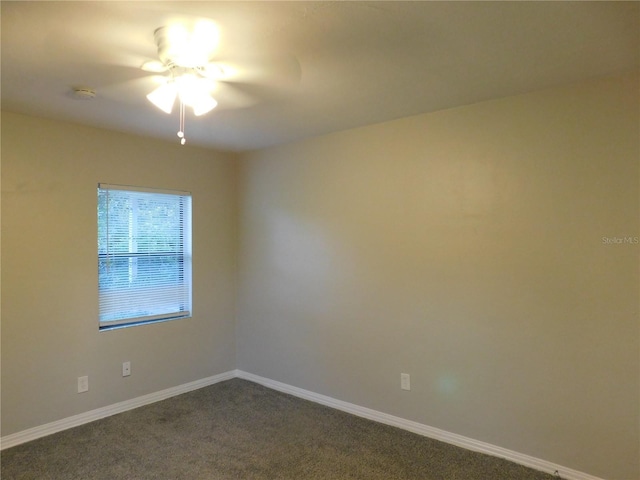 507 Francis Blvd, Lakeland, FL 33801 - unfurnished room with dark carpet, a ceiling fan, and a smoke detector