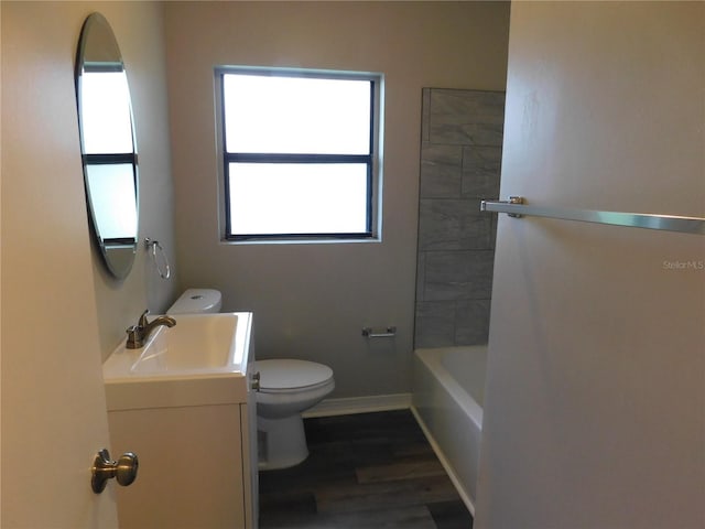 507 Francis Blvd, Lakeland, FL 33801 - bathroom featuring vanity, wood finished floors, and bathing tub / shower combination
