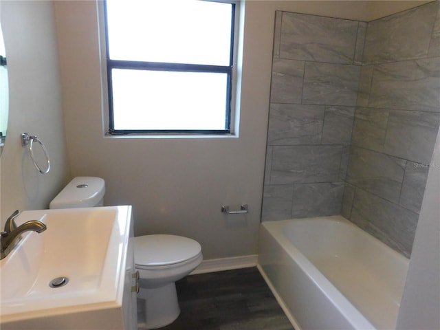 507 Francis Blvd, Lakeland, FL 33801 - full bath featuring wood finished floors, vanity, and shower / bathtub combination