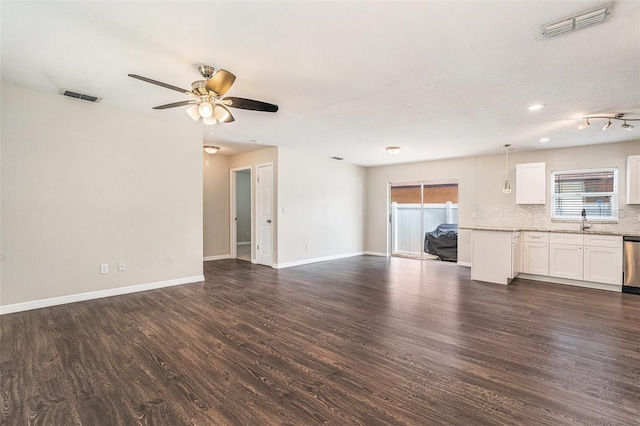 6601 N Elizabeth St, Tampa, FL 33604 - unfurnished living room with dark wood-style floors and a ceiling fan