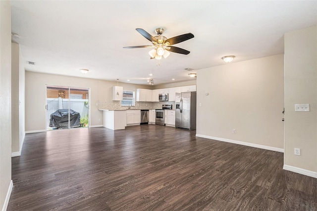6601 N Elizabeth St, Tampa, FL 33604 - unfurnished living room with ceiling fan and dark wood-style floors