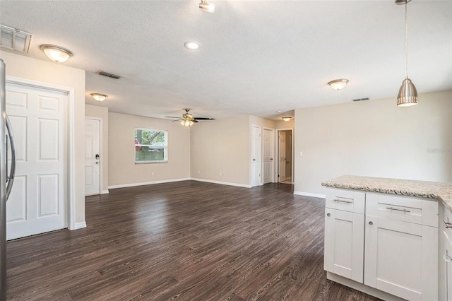 6601 N Elizabeth St, Tampa, FL 33604 - unfurnished living room featuring ceiling fan, dark wood-style floors, a textured ceiling, and recessed lighting