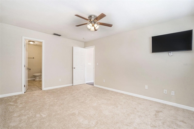 6601 N Elizabeth St, Tampa, FL 33604 - unfurnished bedroom featuring carpet flooring, ensuite bathroom, and ceiling fan