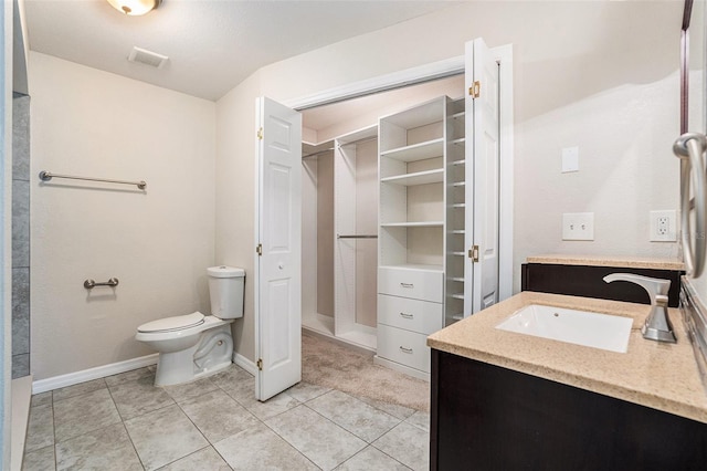 6601 N Elizabeth St, Tampa, FL 33604 - bathroom with vanity, a spacious closet, and tile patterned floors
