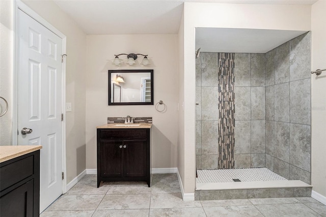 6601 N Elizabeth St, Tampa, FL 33604 - bathroom featuring vanity, a tile shower, and tile patterned flooring