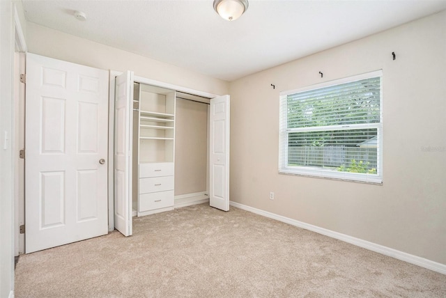 6601 N Elizabeth St, Tampa, FL 33604 - unfurnished bedroom with light carpet and a closet