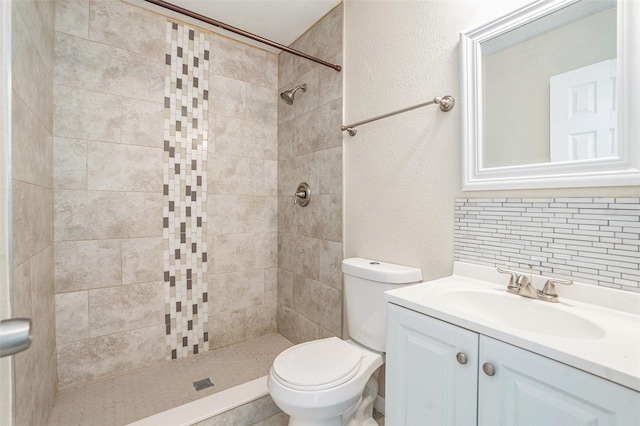 6601 N Elizabeth St, Tampa, FL 33604 - full bath with decorative backsplash, a tile shower, vanity, and a textured wall