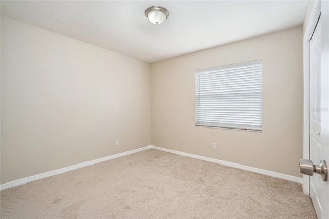 6601 N Elizabeth St, Tampa, FL 33604 - carpeted empty room featuring baseboards