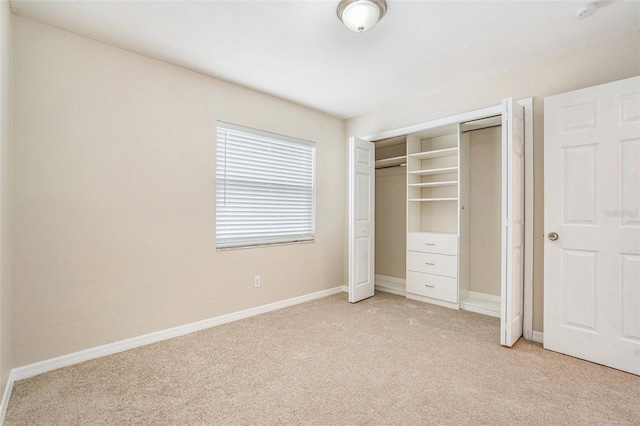 6601 N Elizabeth St, Tampa, FL 33604 - unfurnished bedroom with light colored carpet and a closet