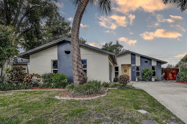 10900 65th Way N, Pinellas Park, FL 33782 - mid-century modern home with stucco siding and concrete driveway