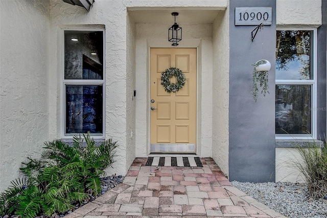 10900 65th Way N, Pinellas Park, FL 33782 - doorway to property with stucco siding