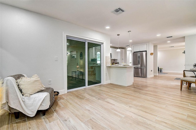 10900 65th Way N, Pinellas Park, FL 33782 - sitting room featuring light wood finished floors and recessed lighting