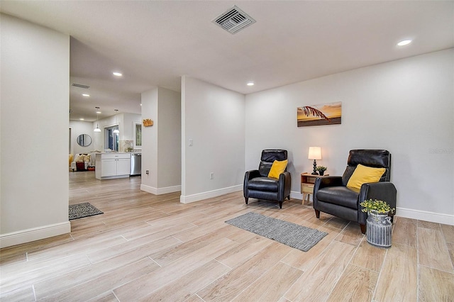 10900 65th Way N, Pinellas Park, FL 33782 - sitting room with light wood-type flooring and recessed lighting