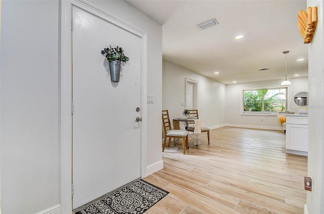10900 65th Way N, Pinellas Park, FL 33782 - foyer entrance featuring light wood-type flooring and recessed lighting