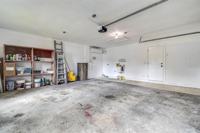 10900 65th Way N, Pinellas Park, FL 33782 - garage with a garage door opener and a wall unit AC