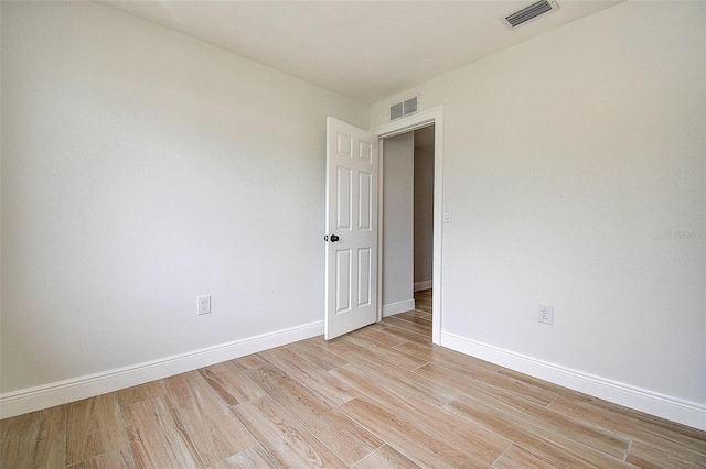 10900 65th Way N, Pinellas Park, FL 33782 - empty room with light wood-style floors and baseboards