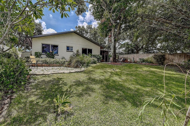 10900 65th Way N, Pinellas Park, FL 33782 - rear view of house featuring stucco siding