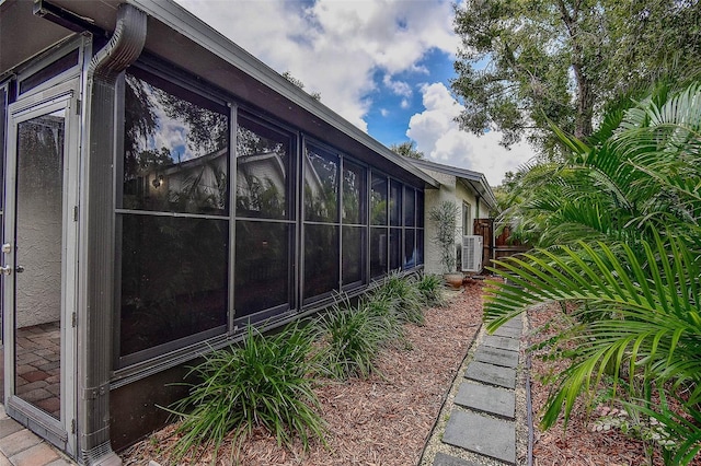 10900 65th Way N, Pinellas Park, FL 33782 - view of home's exterior with a sunroom