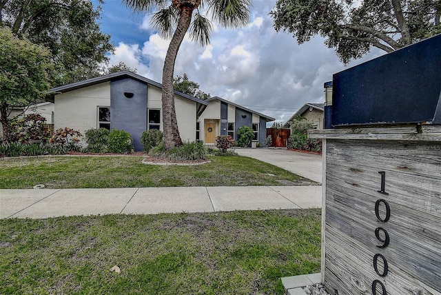 10900 65th Way N, Pinellas Park, FL 33782 - mid-century modern home with stucco siding