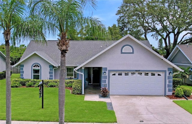 1437 Stonehenge Way, Palm Harbor, FL 34683 - ranch-style house featuring stucco siding, a garage, driveway, and a front lawn