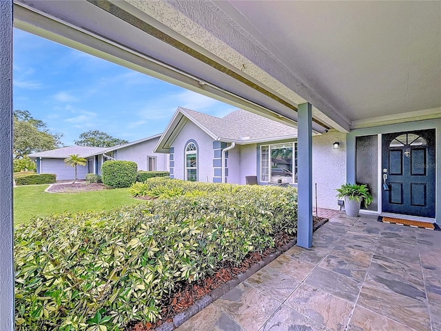 1437 Stonehenge Way, Palm Harbor, FL 34683 - entrance to property featuring stucco siding and a yard