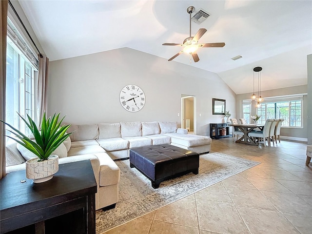 1437 Stonehenge Way, Palm Harbor, FL 34683 - living area featuring vaulted ceiling, light tile patterned floors, and a ceiling fan