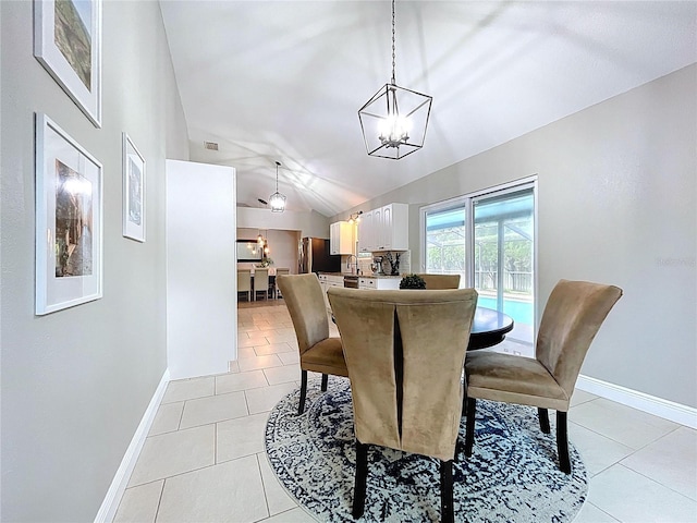 1437 Stonehenge Way, Palm Harbor, FL 34683 - dining room featuring a chandelier, lofted ceiling, and light tile patterned floors