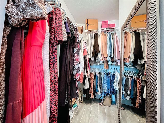 1437 Stonehenge Way, Palm Harbor, FL 34683 - walk in closet featuring a heating unit and wood finished floors