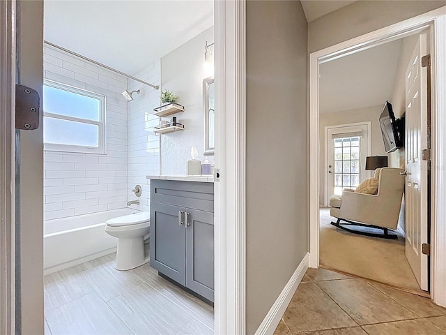 1437 Stonehenge Way, Palm Harbor, FL 34683 - bathroom featuring vanity, shower / bath combination, healthy amount of natural light, and tile patterned floors