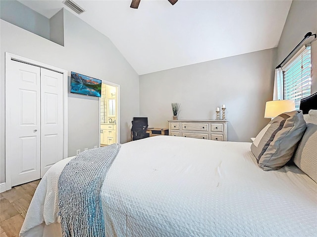 1437 Stonehenge Way, Palm Harbor, FL 34683 - bedroom featuring lofted ceiling, light wood finished floors, ceiling fan, a closet, and connected bathroom