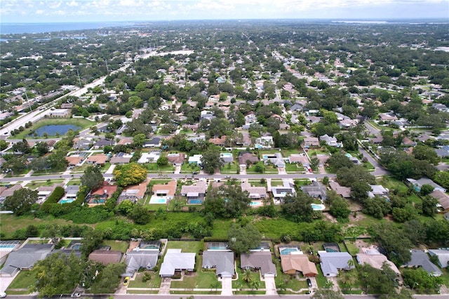 1437 Stonehenge Way, Palm Harbor, FL 34683 - aerial overview of property's location with nearby suburban area and a large body of water