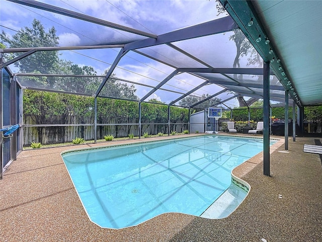 1437 Stonehenge Way, Palm Harbor, FL 34683 - view of swimming pool featuring a storage shed, a fenced backyard, glass enclosure, and a patio