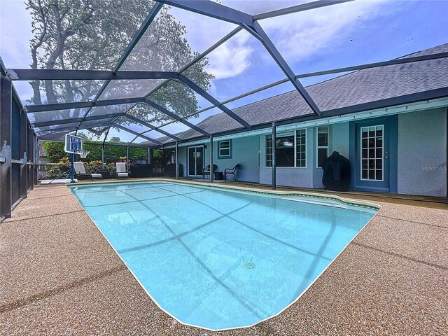 1437 Stonehenge Way, Palm Harbor, FL 34683 - swimming pool with a patio and glass enclosure