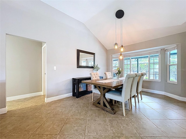 1437 Stonehenge Way, Palm Harbor, FL 34683 - dining area with lofted ceiling and light tile patterned floors