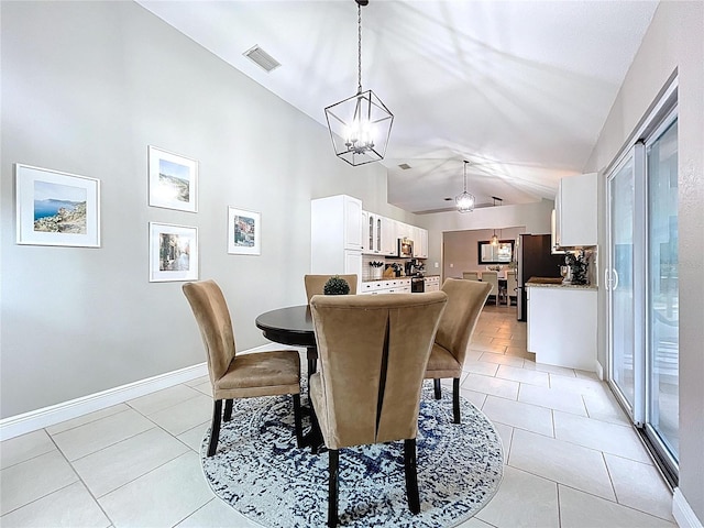 1437 Stonehenge Way, Palm Harbor, FL 34683 - dining room with lofted ceiling, light tile patterned flooring, a chandelier, and a ceiling fan