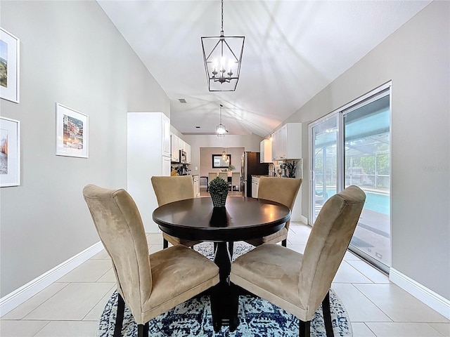 1437 Stonehenge Way, Palm Harbor, FL 34683 - dining area featuring a chandelier, lofted ceiling, and light tile patterned flooring