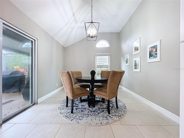 1437 Stonehenge Way, Palm Harbor, FL 34683 - dining space featuring light tile patterned floors, a chandelier, and lofted ceiling