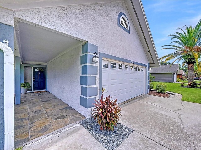 1437 Stonehenge Way, Palm Harbor, FL 34683 - garage featuring concrete driveway