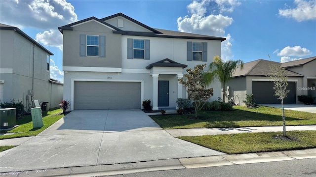 31363 Sun Kettle Loop, Wesley Chapel, FL 33545 - view of front of property with stucco siding, driveway, a front lawn, and a garage