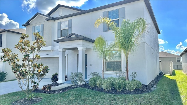 31363 Sun Kettle Loop, Wesley Chapel, FL 33545 - traditional-style house featuring an attached garage and stucco siding