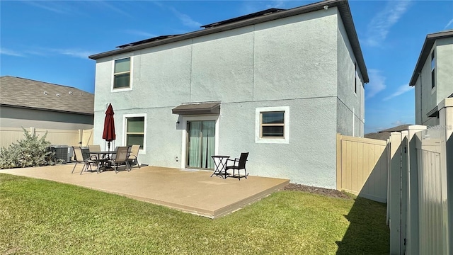 31363 Sun Kettle Loop, Wesley Chapel, FL 33545 - back of property with a patio and stucco siding