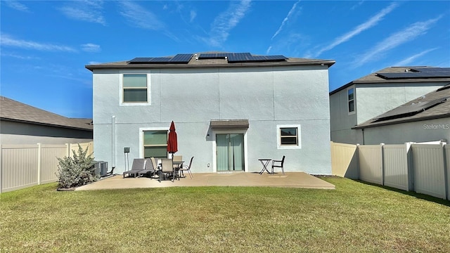 31363 Sun Kettle Loop, Wesley Chapel, FL 33545 - back of house with a patio, solar panels, and stucco siding