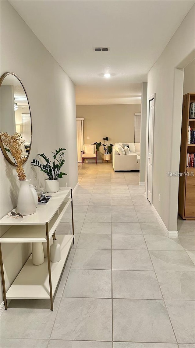 31363 Sun Kettle Loop, Wesley Chapel, FL 33545 - corridor with light tile patterned flooring and baseboards
