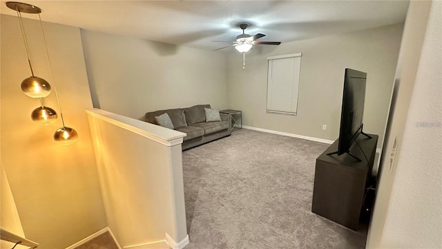 31363 Sun Kettle Loop, Wesley Chapel, FL 33545 - carpeted living room featuring ceiling fan and baseboards
