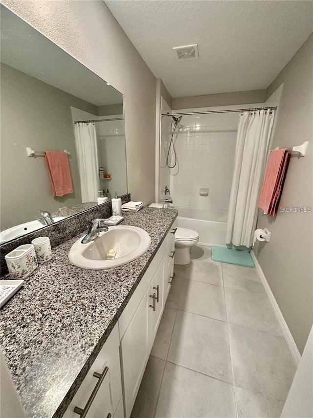31363 Sun Kettle Loop, Wesley Chapel, FL 33545 - full bath featuring vanity, shower / bath combination with curtain, tile patterned floors, and a textured ceiling