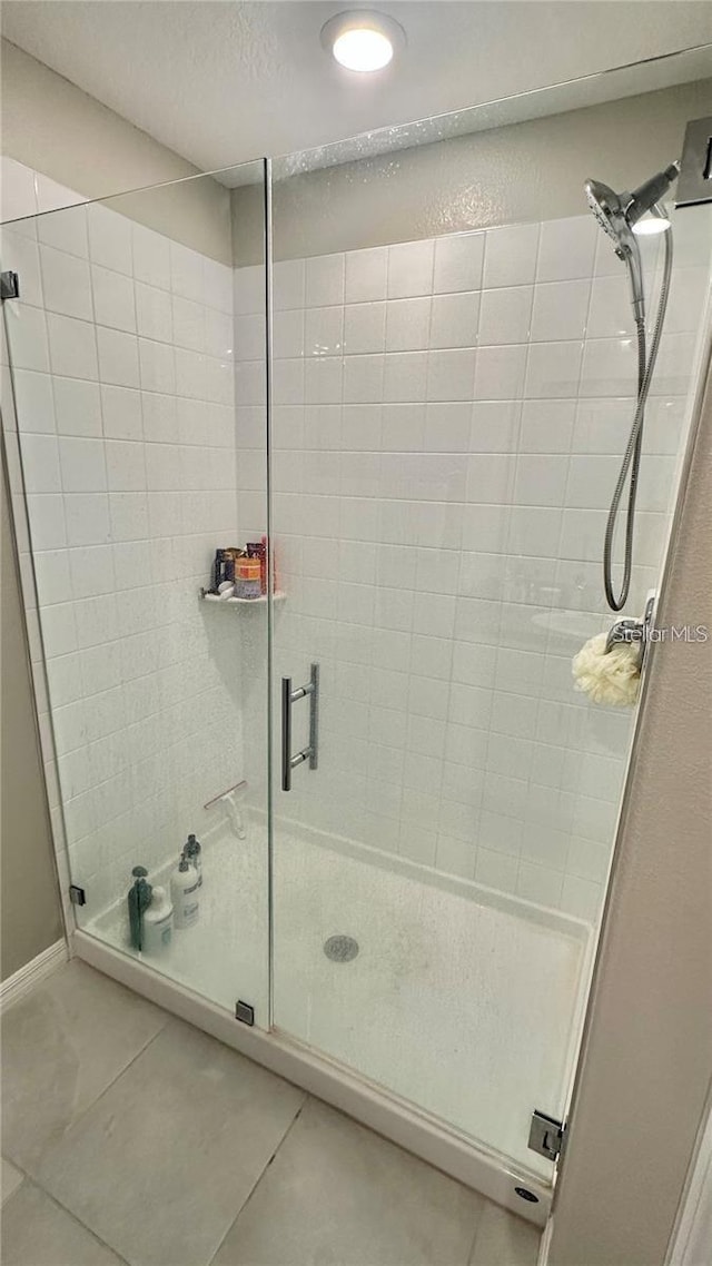 31363 Sun Kettle Loop, Wesley Chapel, FL 33545 - bathroom featuring a shower stall, tile patterned floors, recessed lighting, and a textured ceiling