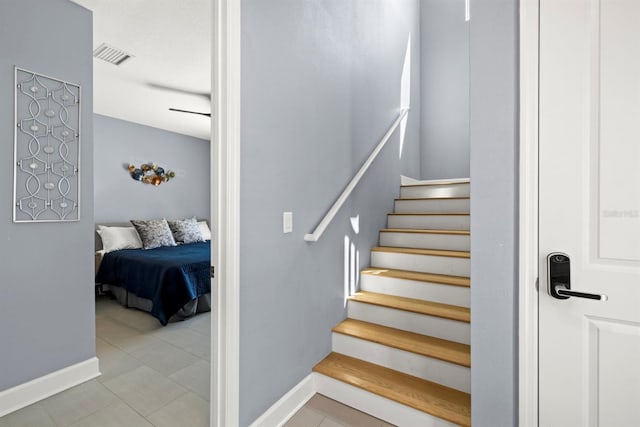 4311 W Fig St Unit 1, Tampa, FL 33609 - staircase with baseboards and tile patterned flooring