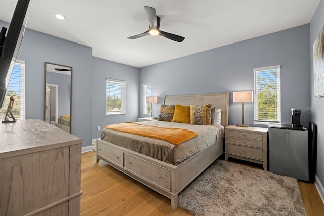 4311 W Fig St Unit 1, Tampa, FL 33609 - bedroom featuring light wood-style flooring, multiple windows, recessed lighting, and a ceiling fan
